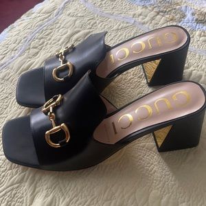 Gucci women’s slide sandals with horsebit.